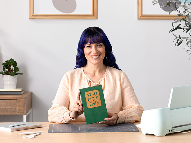 A woman showing you how to create a greeting card using her Cricut Explore 3